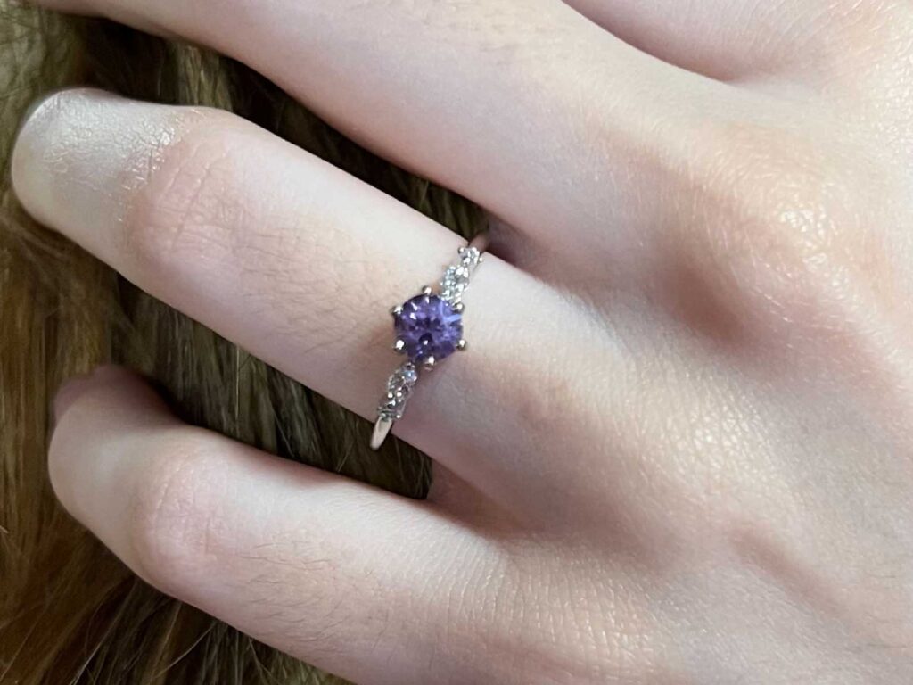 Alita lavender sapphire and diamond ring worn on hand for scale