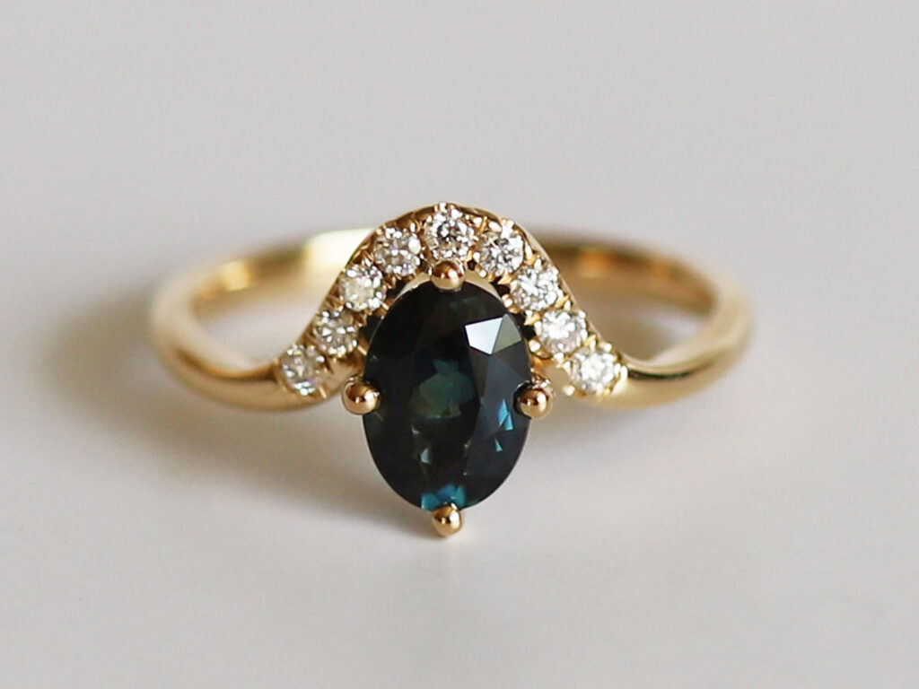 Mila Australian teal sapphire and diamond ring front setting detail