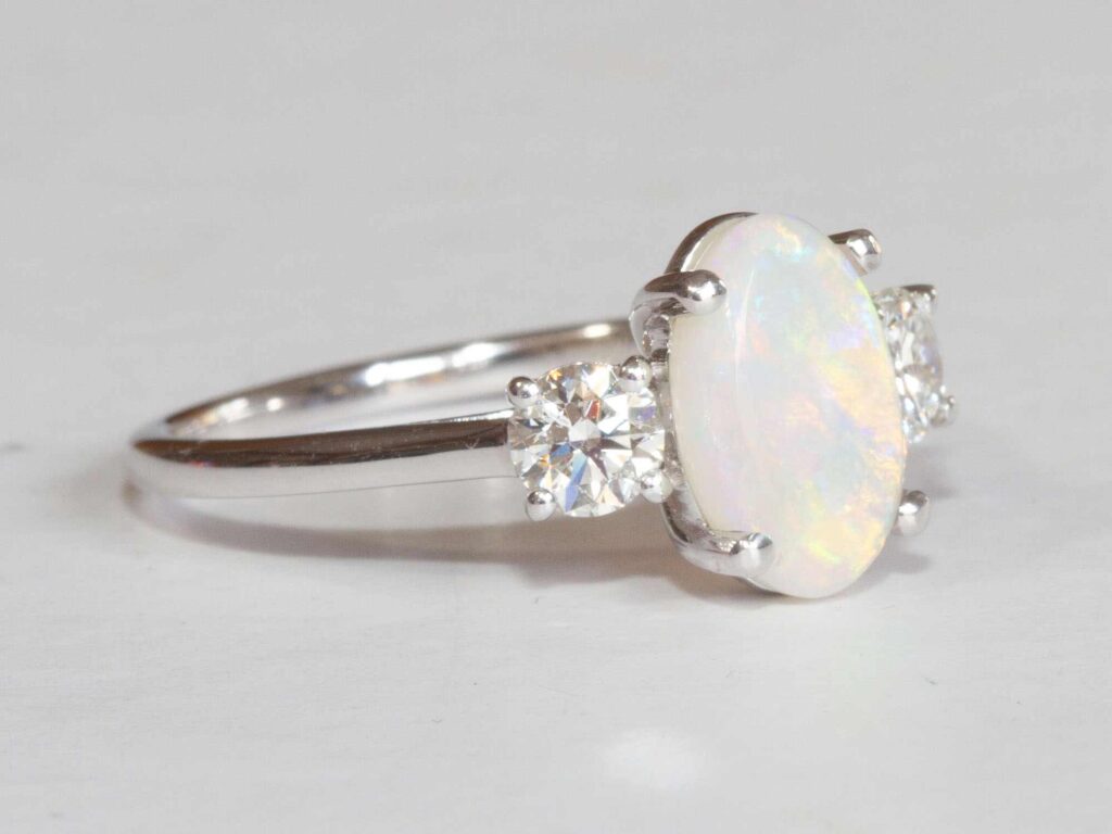 Olympia Lightning Ridge white opal and diamond ring second profile view
